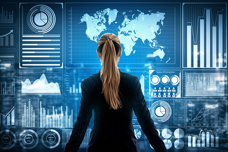 woman in suit facing numerous digital graphs